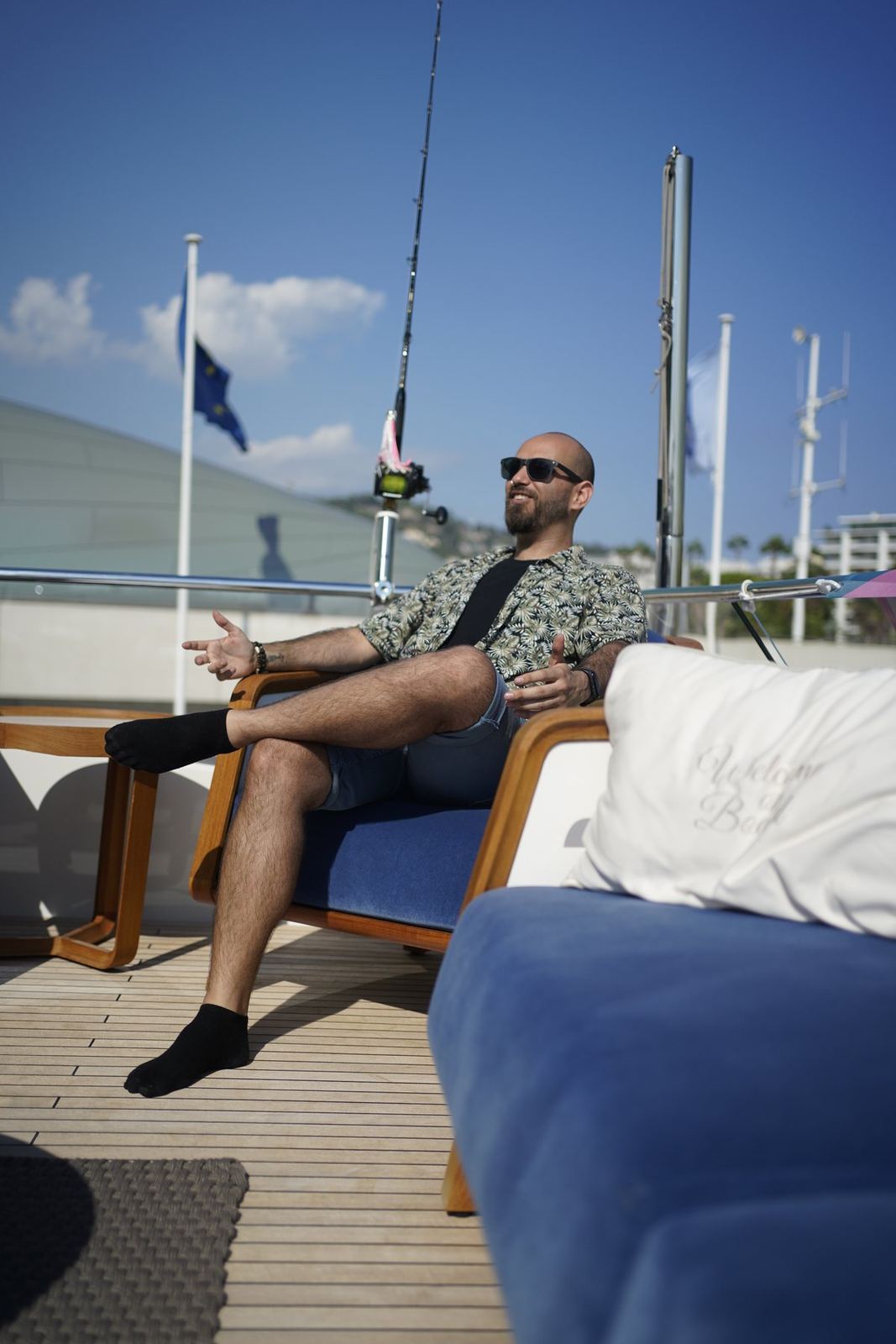Nicolás relaxing on the deck of a yacht