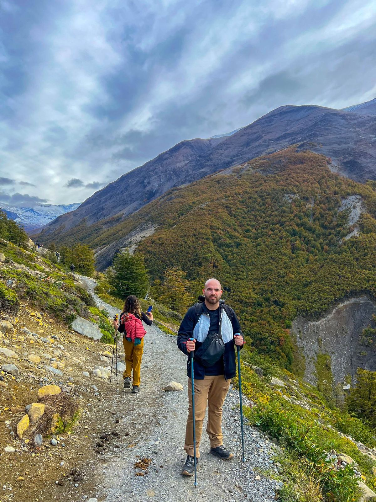 Two hikers on a mountain trail